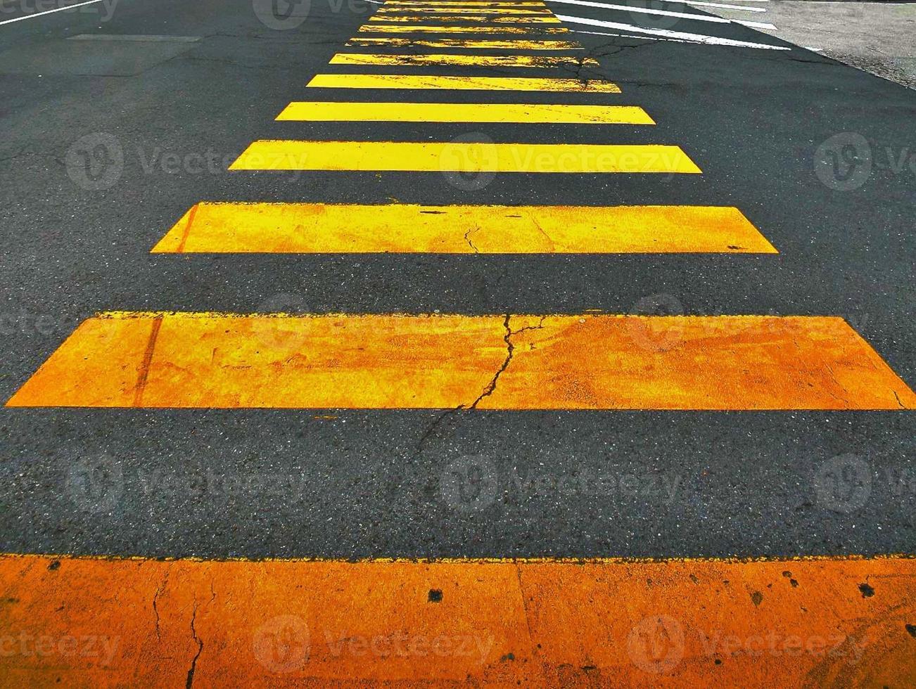 Zebra lines on road as symbol for cross walk way photo