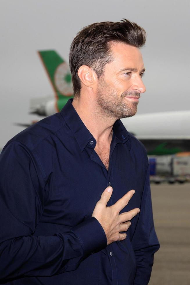 LOS ANGELES, SEPT 23 -  Hugh Jackman arrives as Virgin America unveils new DreamWorks  Reel Steel  plane at LAX Airport on September 23, 2011 in Los Angeles, CA photo