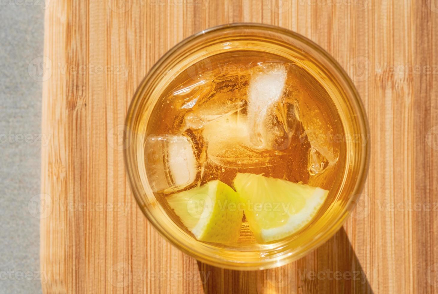 Golden rum on the rocks photo