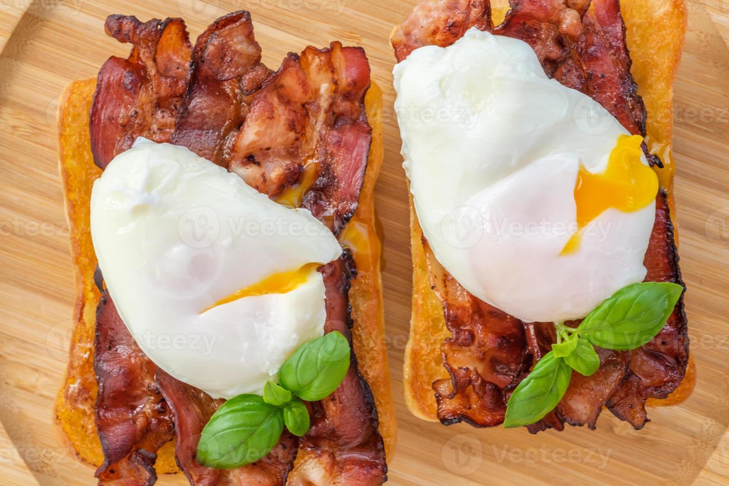 Sandwich with poached egg and bacon photo