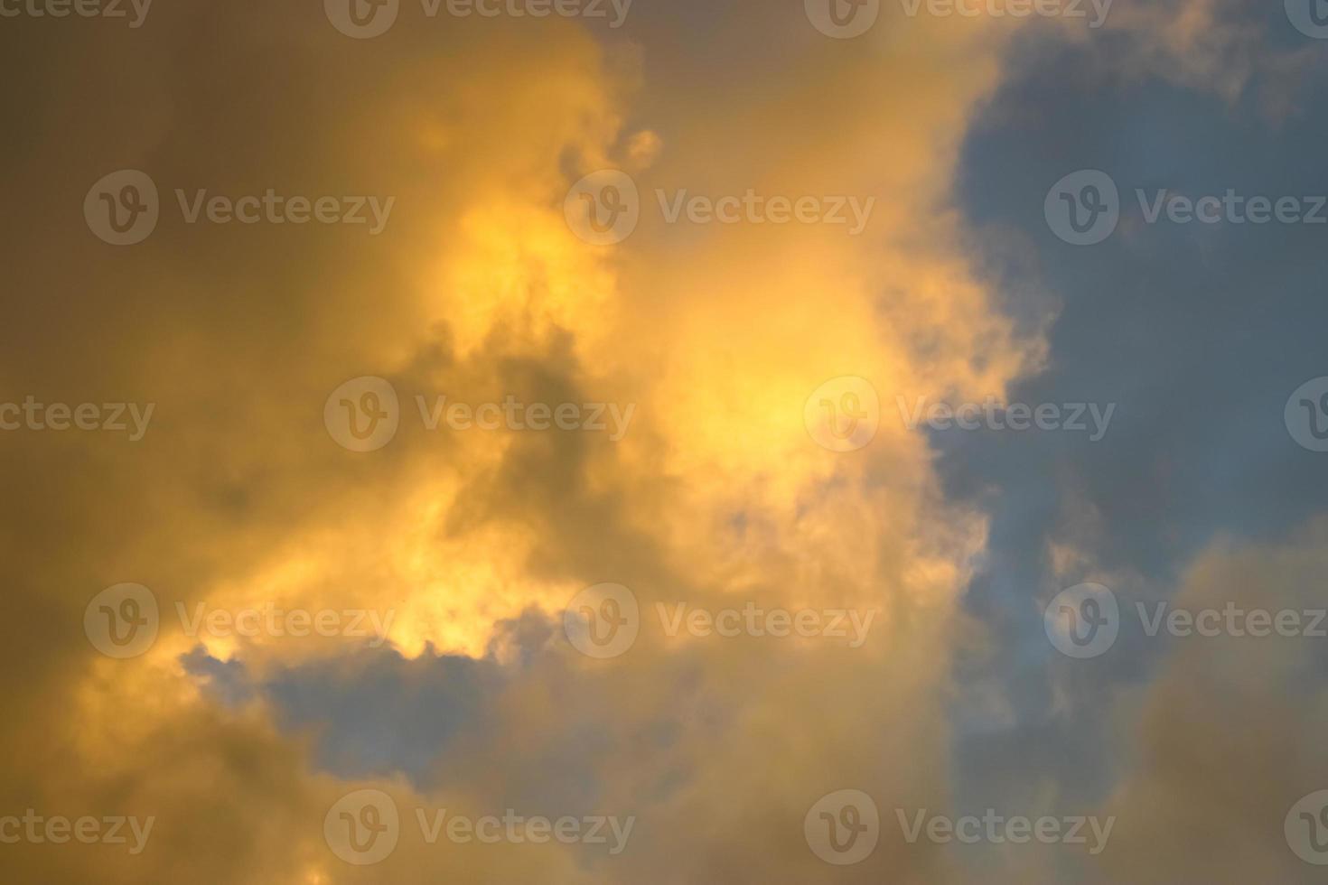 Beautiful panorama of orange and yellow clouds at sunrise photo