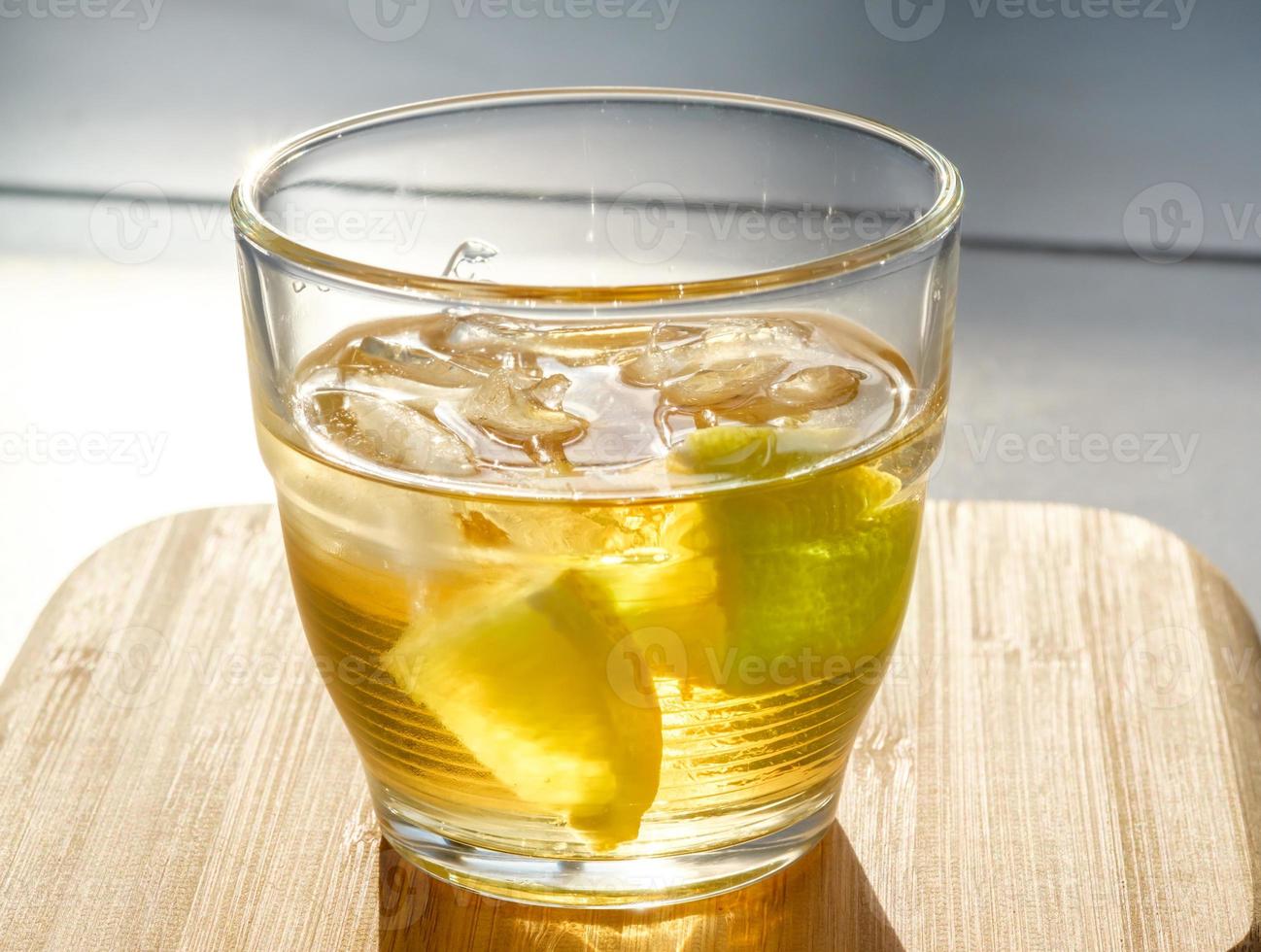 Golden rum on the rocks photo