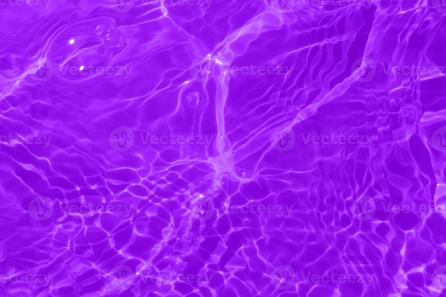 Defocus blurred purple watercolor in swimming pool rippled water detail background. Water splash, water spray background. photo