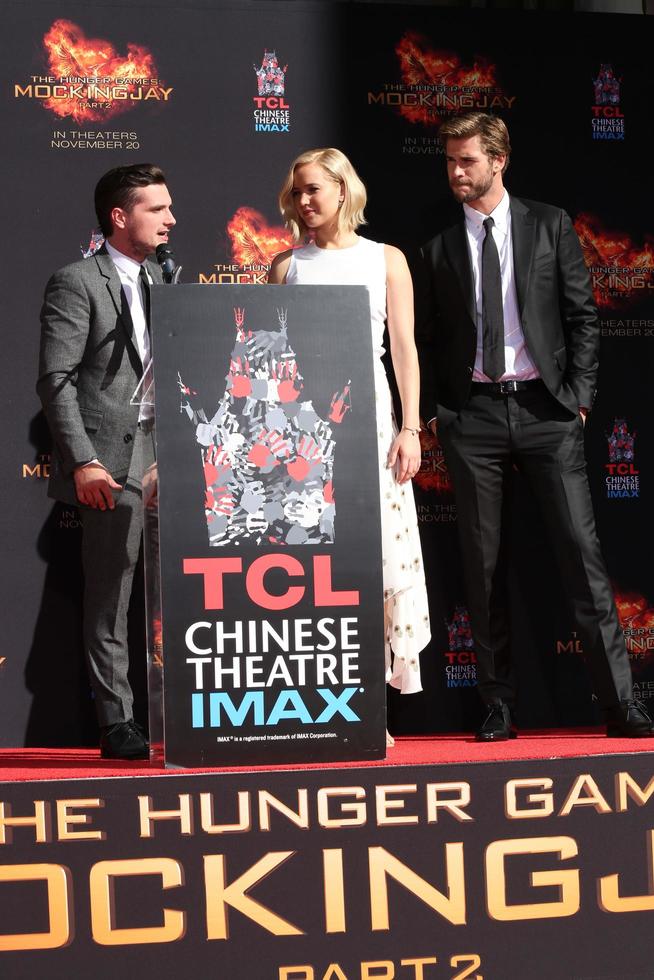 LOS ANGELES, OCT 31 -  Josh Hutcherson, Jennifer Lawrence, Liam Hemsworth at the Hunger Games Handprint and Footprint Ceremony at the TCL Chinese Theater on October 31, 2015 in Los Angeles, CA photo