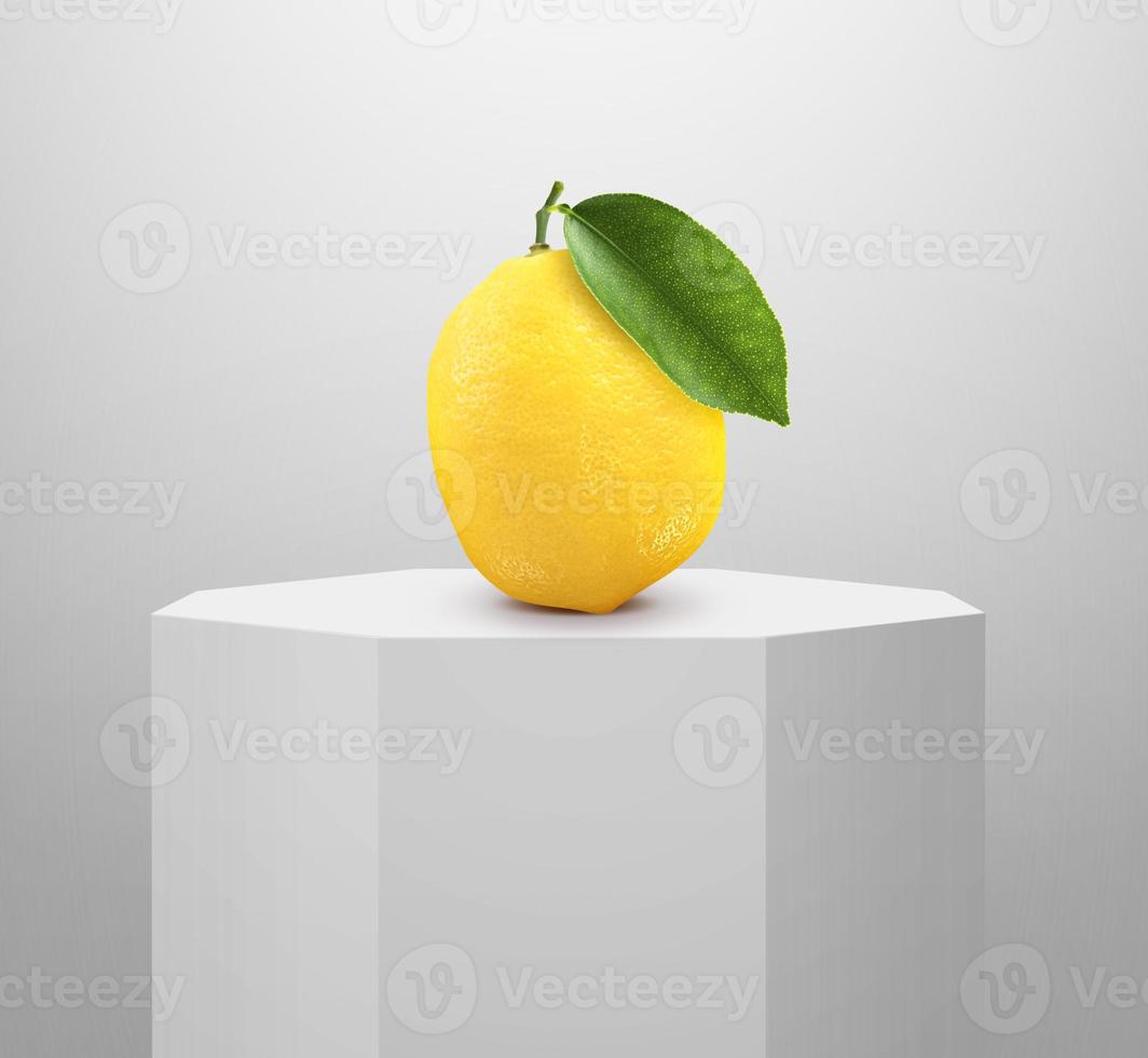 lemon on Shiny white round pedestal podium photo