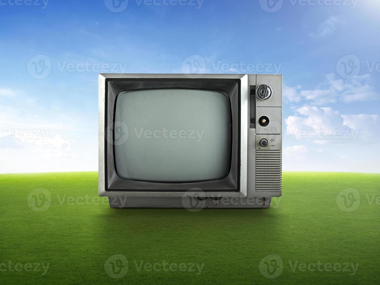 Vintage retro tv on grass photo