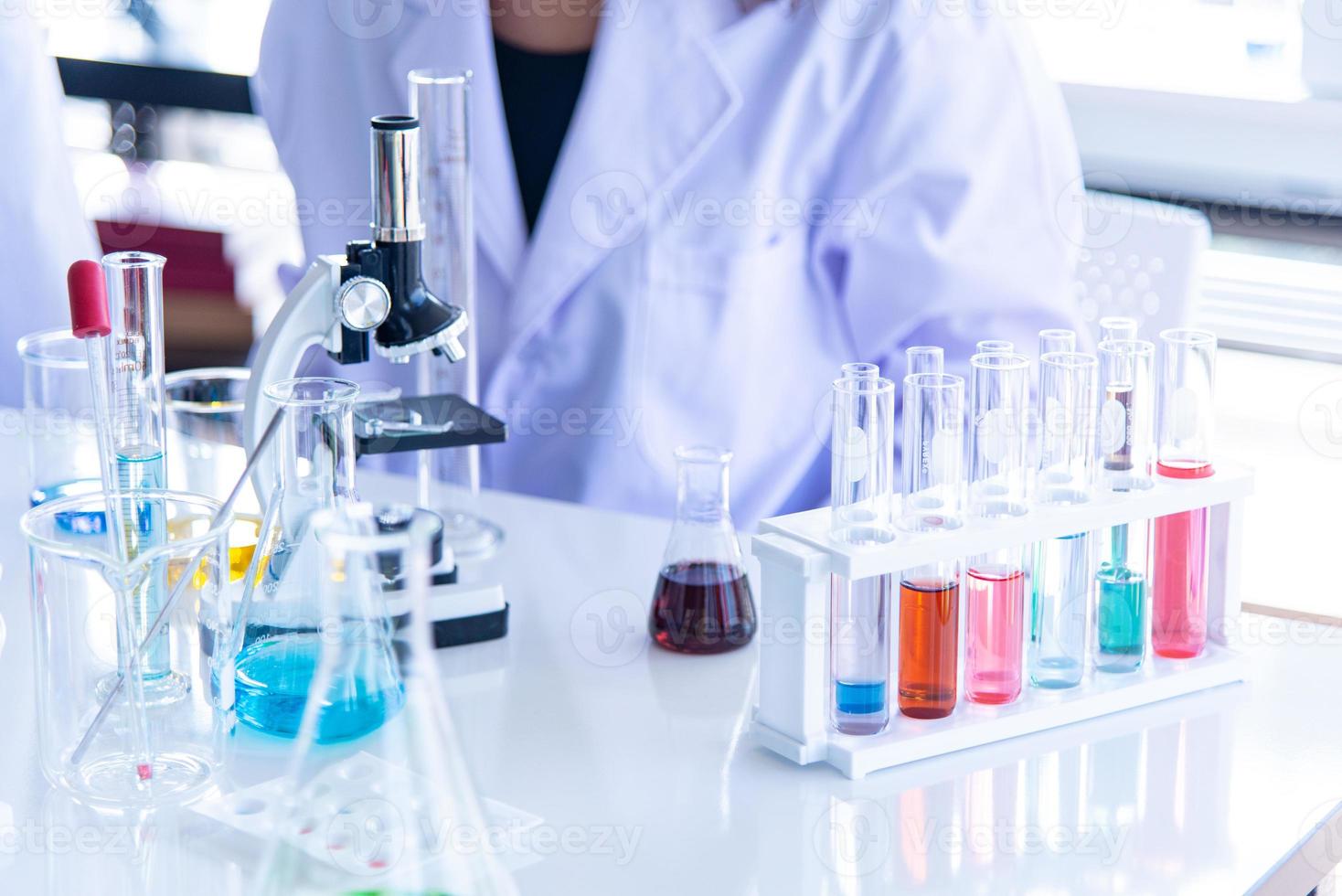 Preparing chemical, medical Laboratory equipments on the white table. The chemistry experiment in scientific or medical research photo