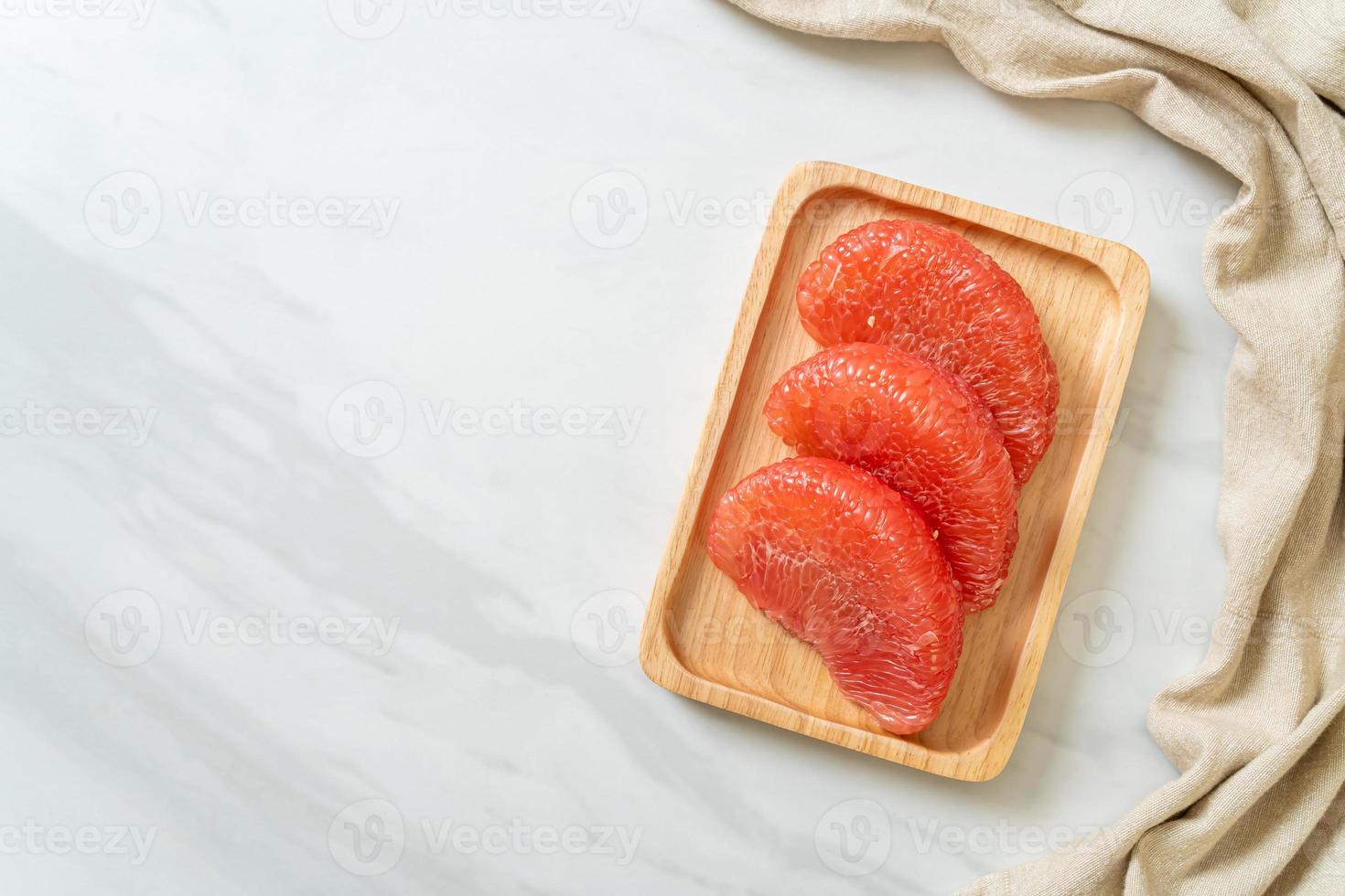 fresh red pomelo fruit or grapefruit photo