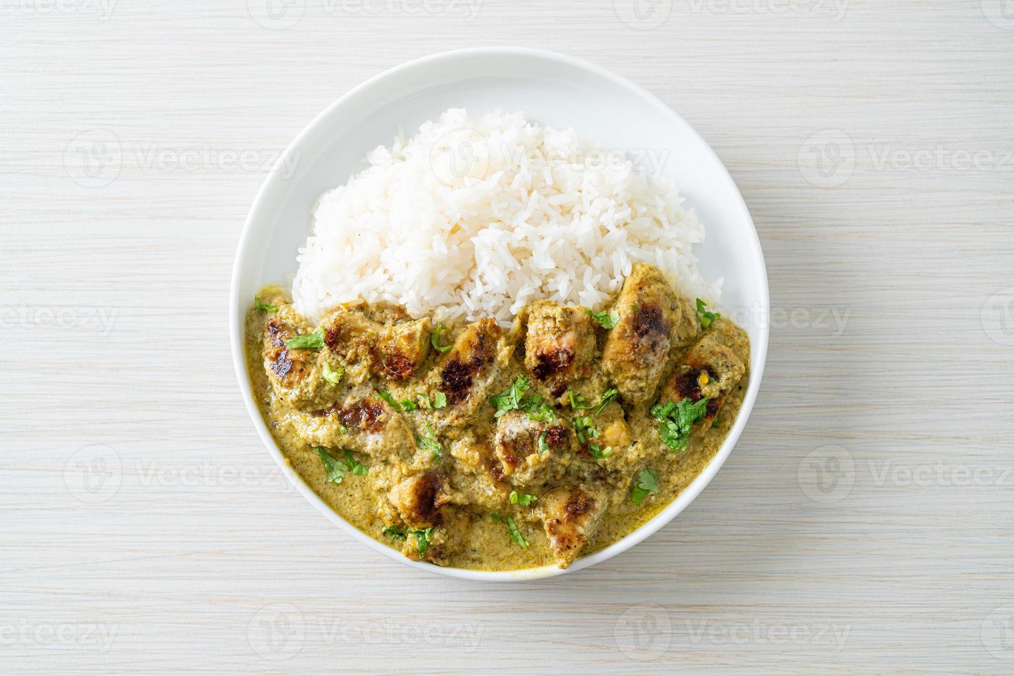 Afghani chicken in green curry or Hariyali tikka chicken hara masala with rice photo