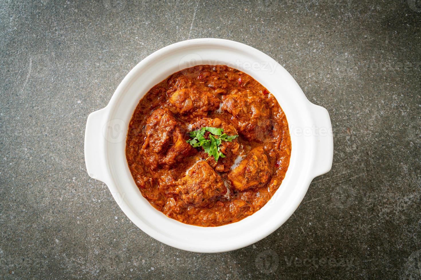 chicken tikka masala spicy curry meat food with roti or naan bread photo