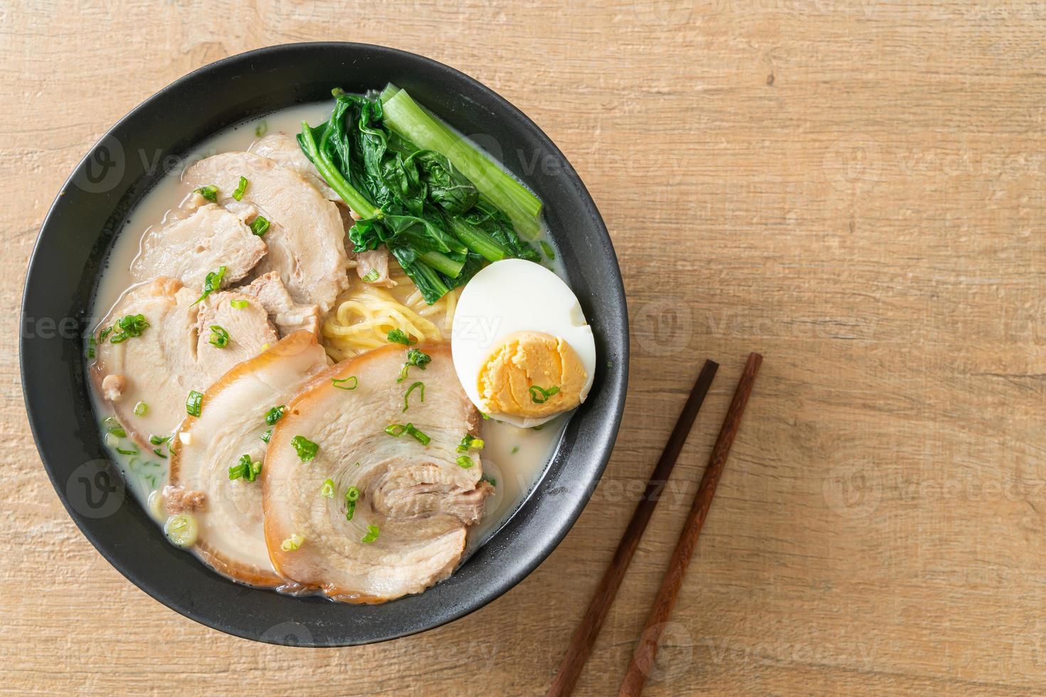 Ramen noodles in pork bone soup with roast pork and egg photo