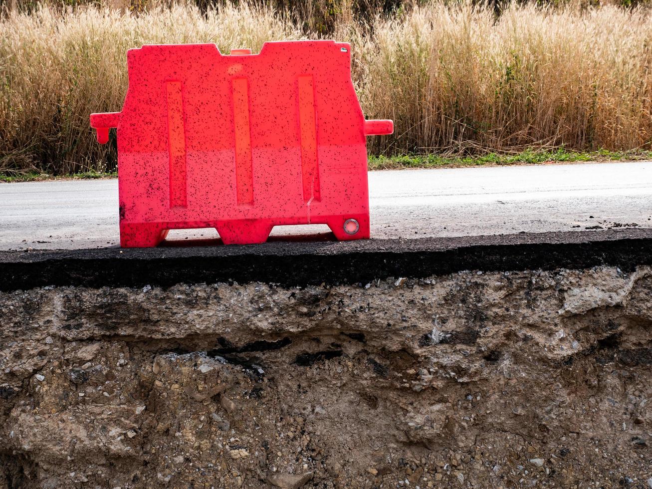 Close to rocky and sandy soils under paved roads photo