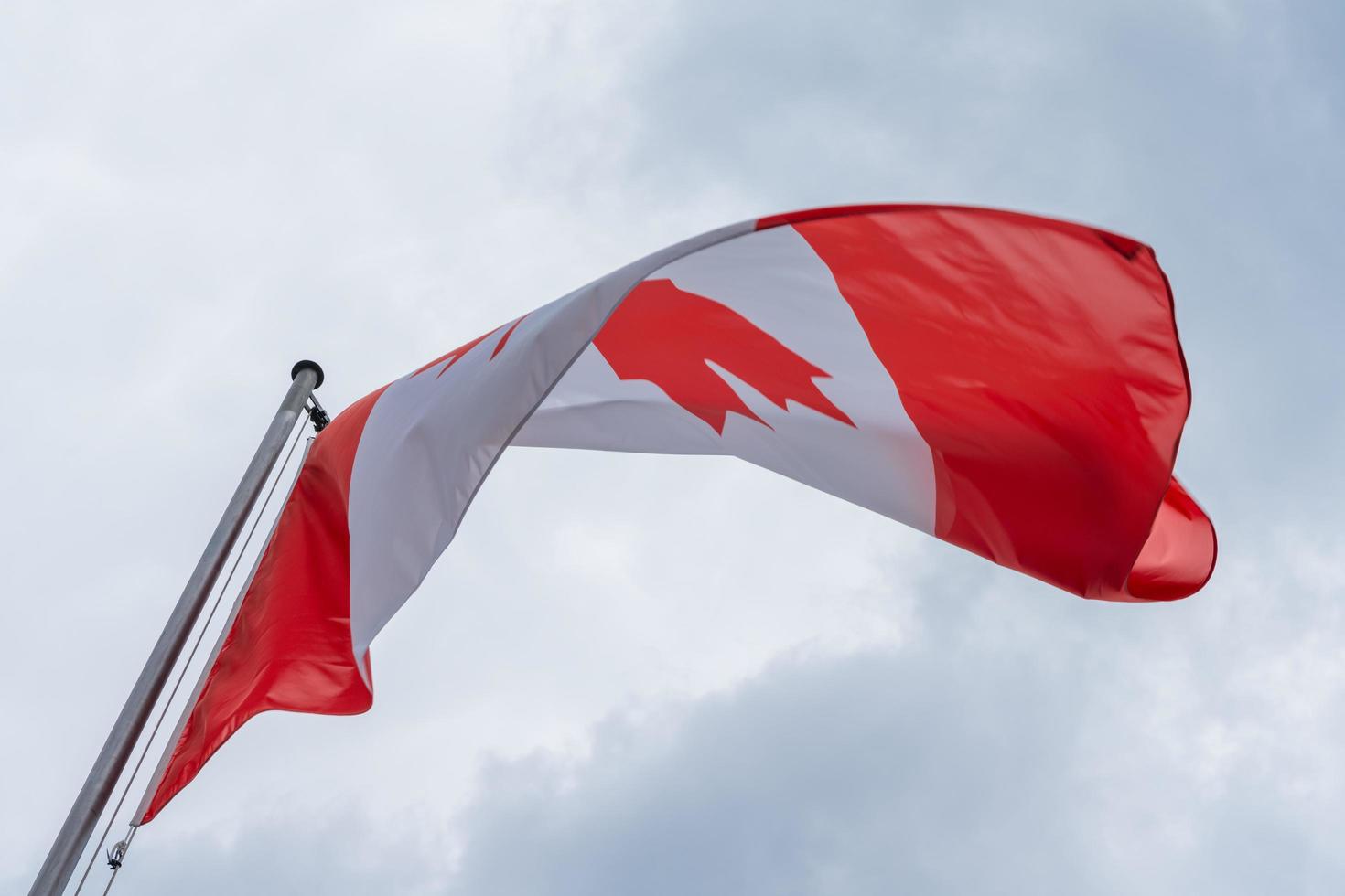 Canadian flag waving in the wind photo