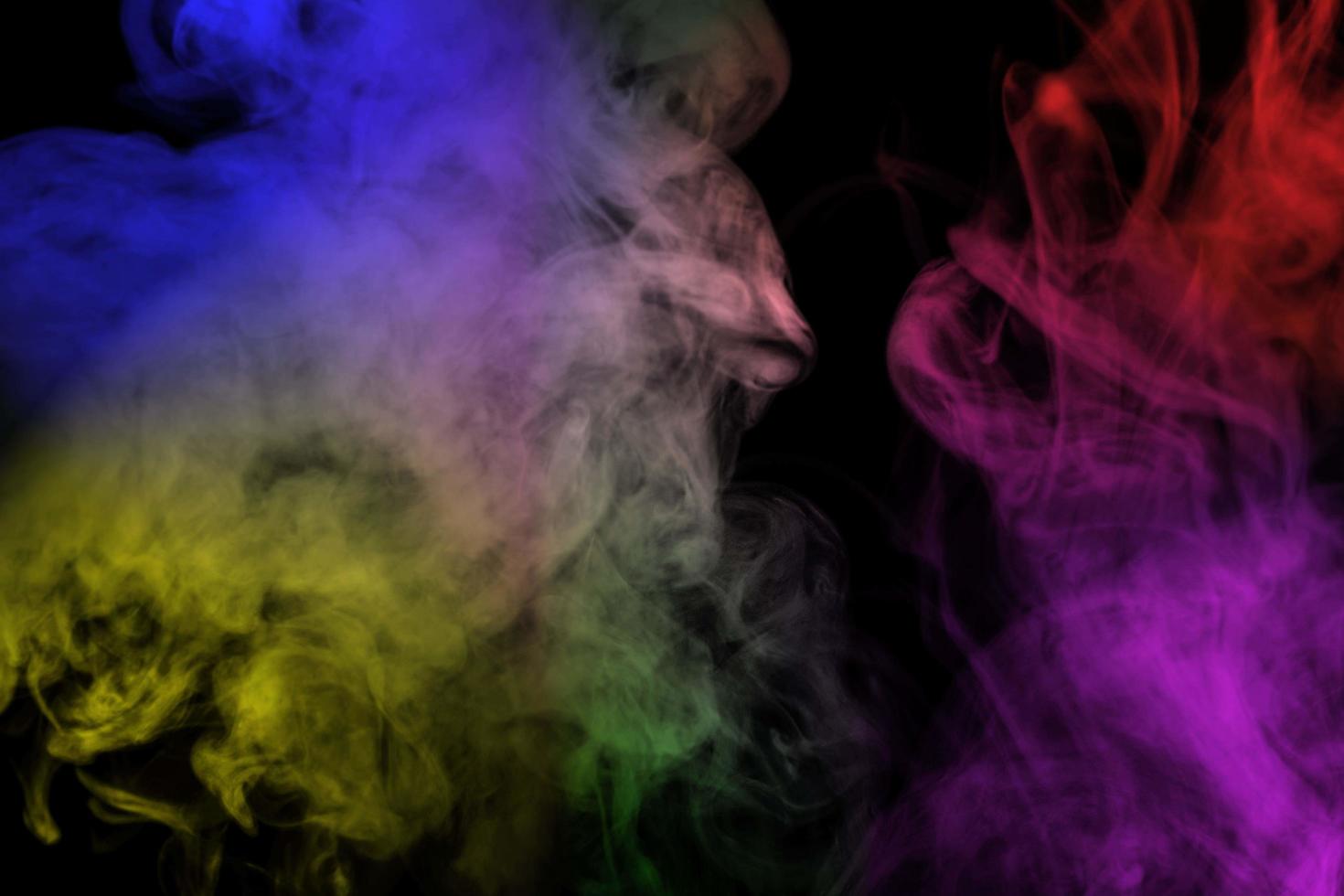 Abstract colorful smoke isolated on black background,Rainbow powder photo