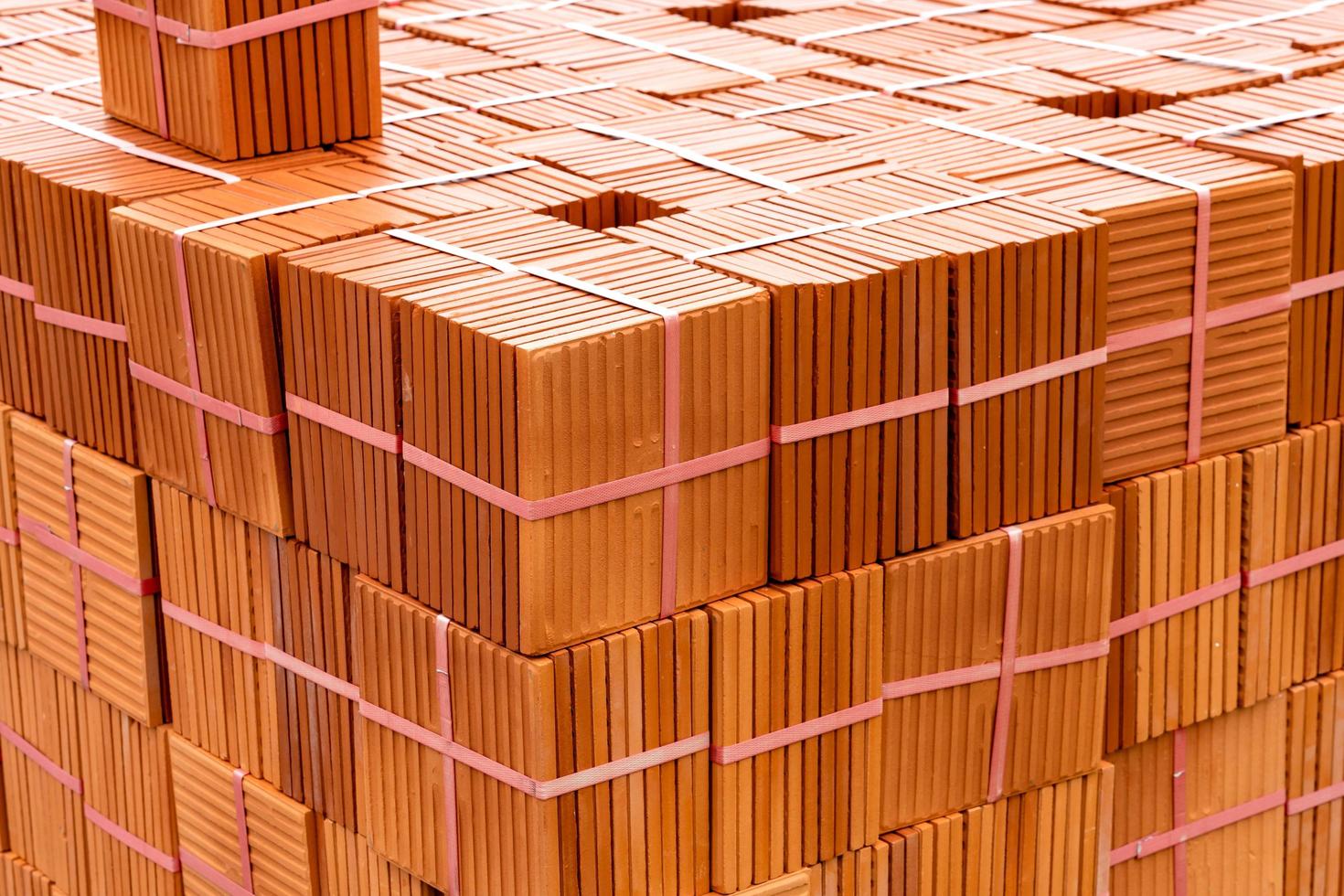 Stack of brown tiles at the constructing site photo