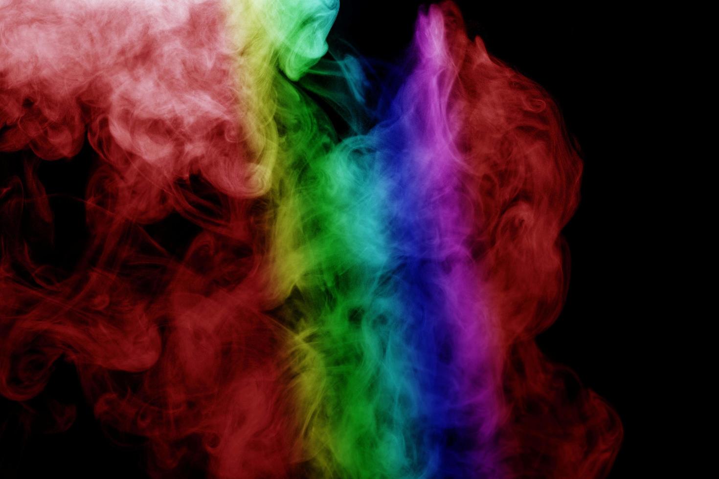 Abstract smoke isolated on black background,Rainbow powder photo