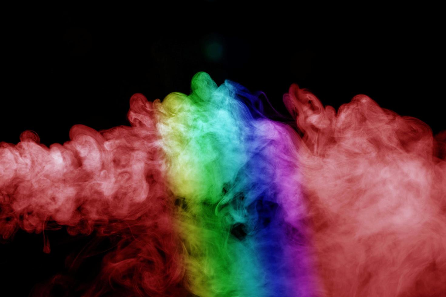 Abstract smoke isolated on black background,Rainbow powder photo