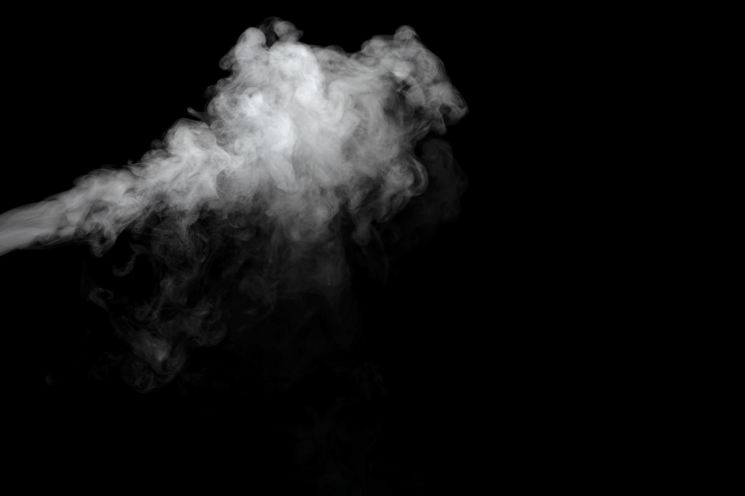 Abstract powder or smoke effect isolated on black background photo