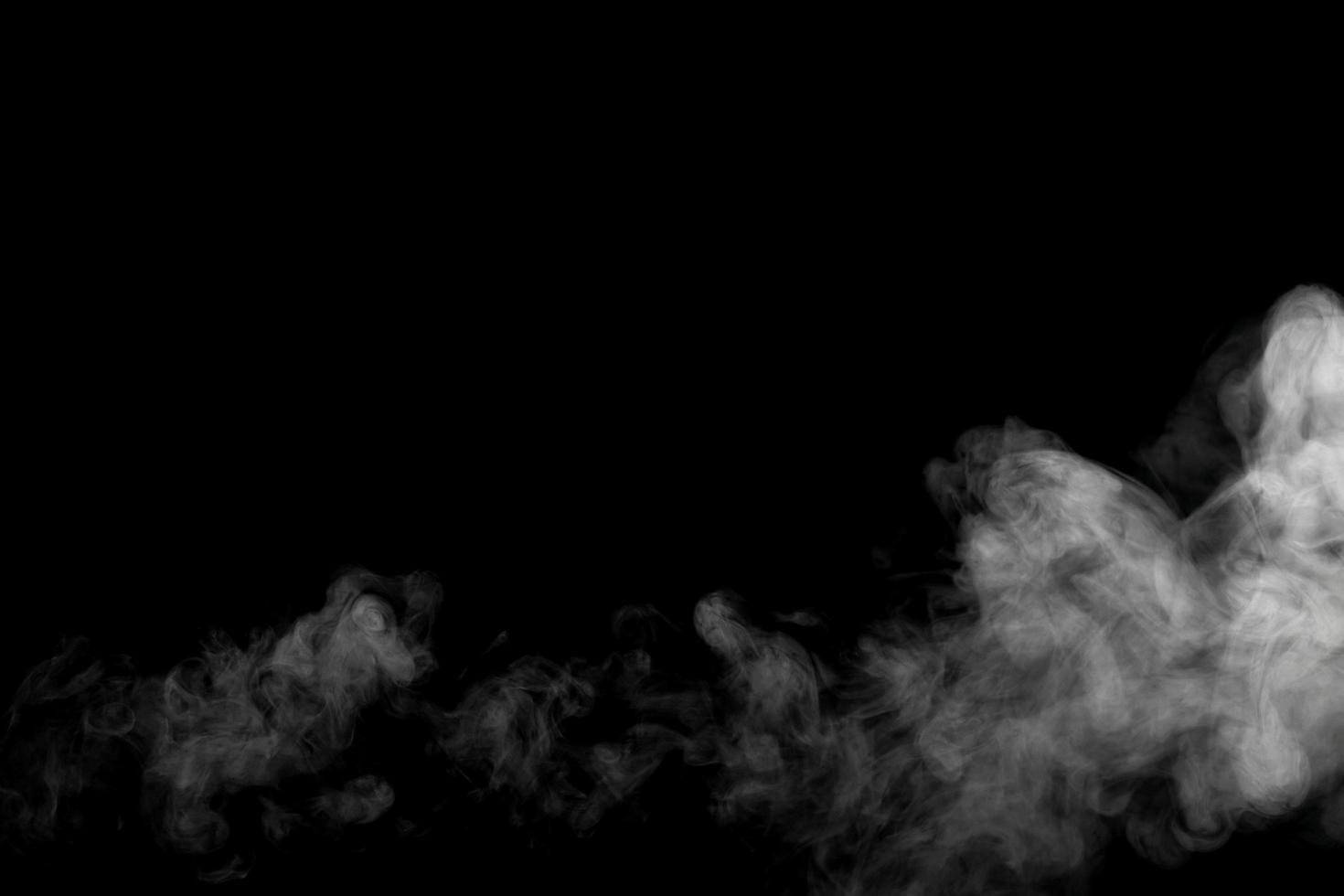 Abstract powder or smoke effect isolated on black background photo