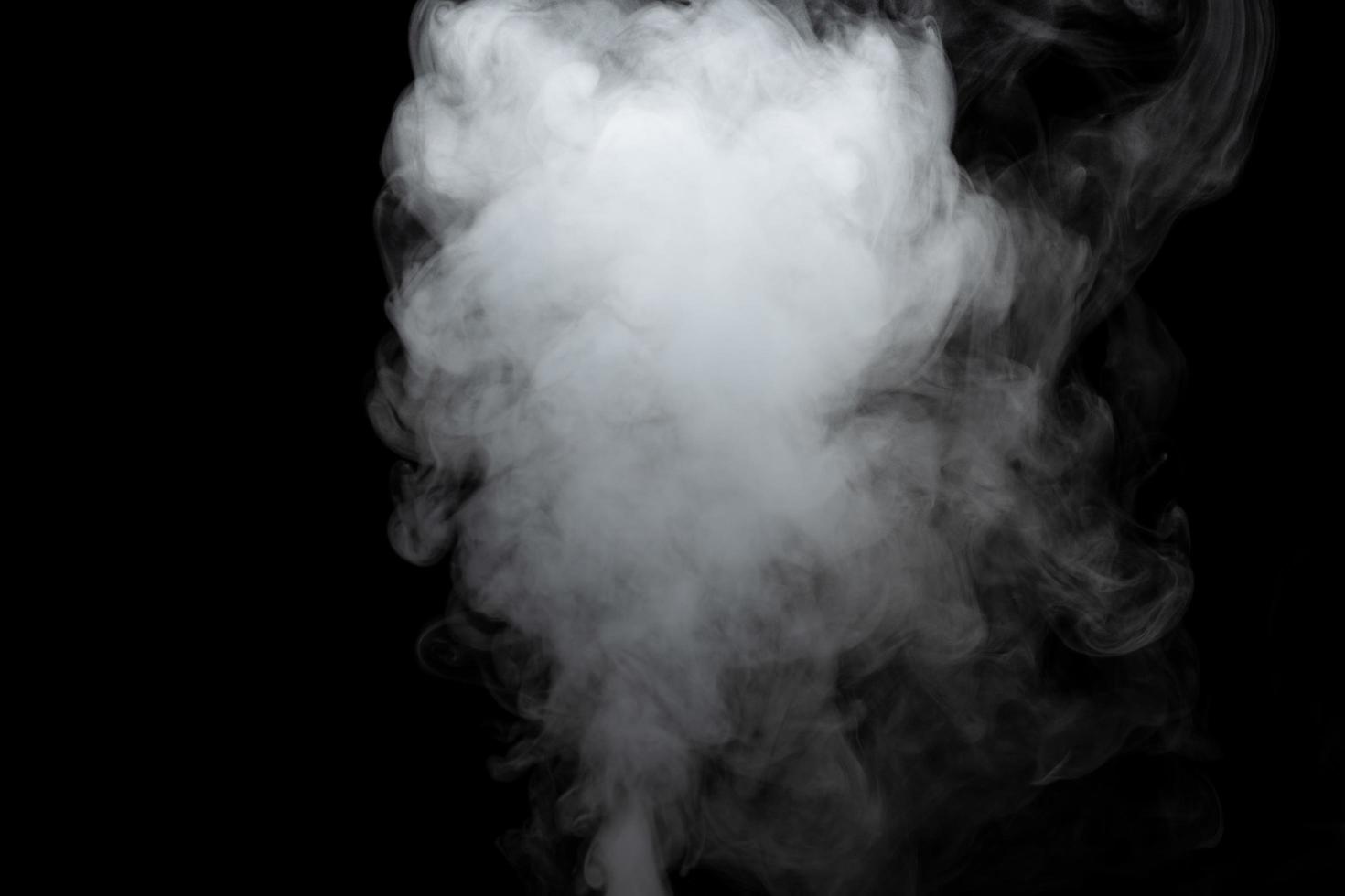 Abstract powder or smoke effect isolated on black background photo
