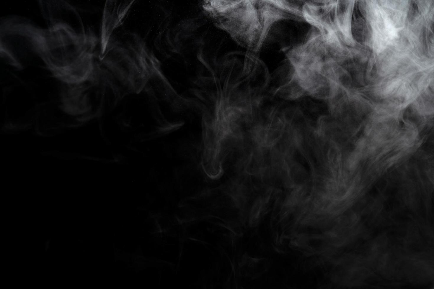 Abstract powder or smoke effect isolated on black background photo