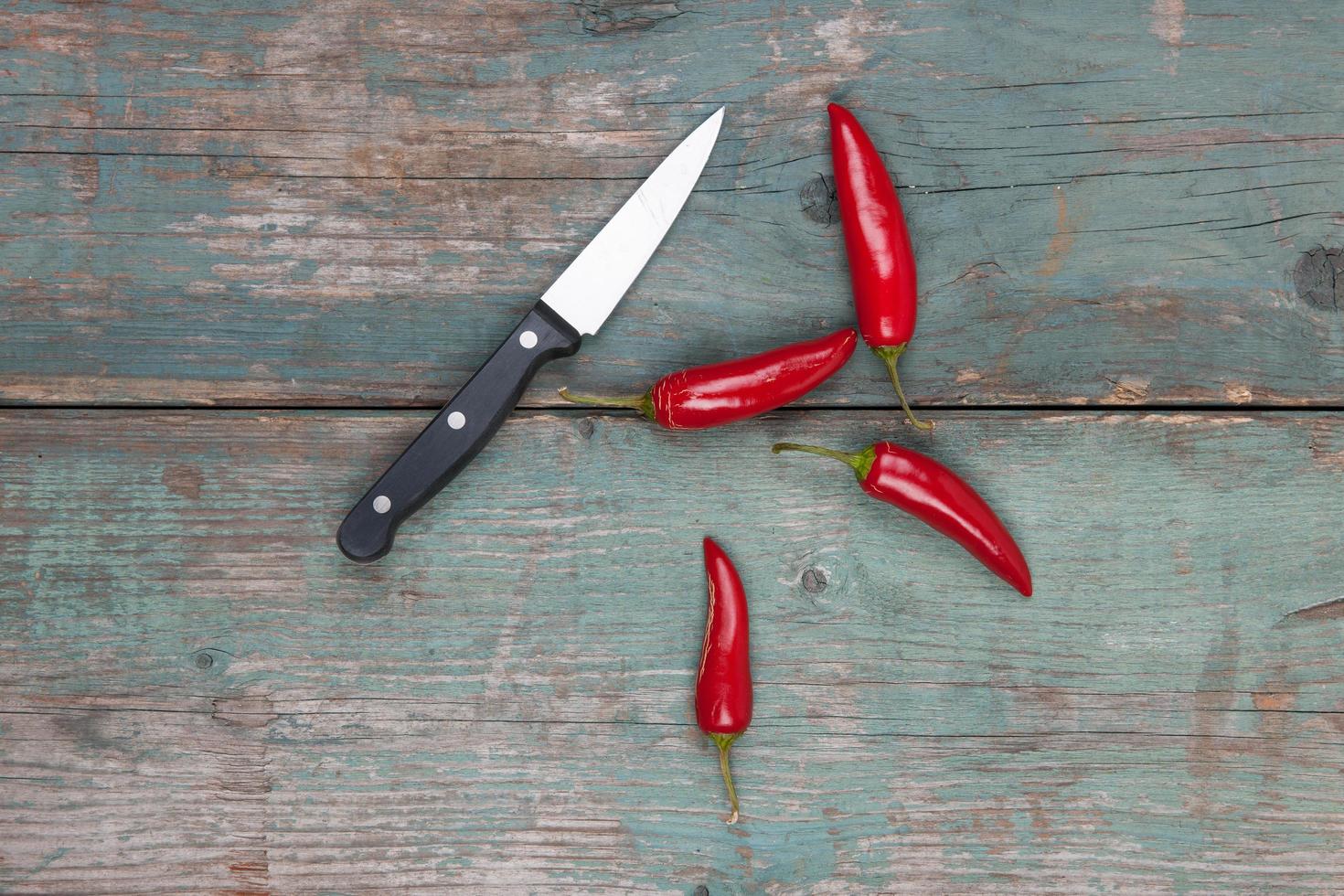 Red peppers on table photo