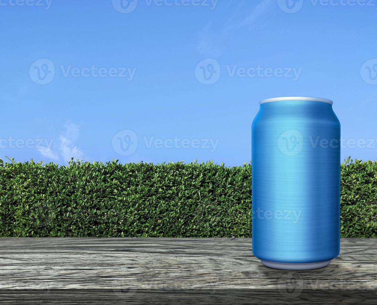 Aluminum cans on wooden table terrace with green grass wall texture and bright blue sky photo