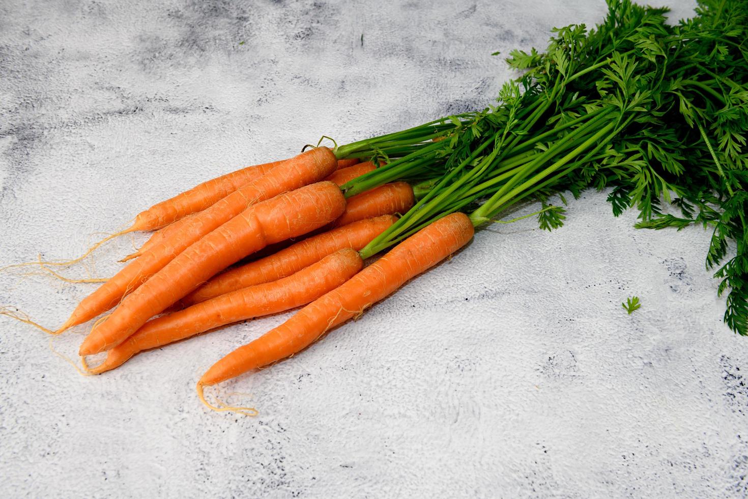 Carrots on a rustic table photo