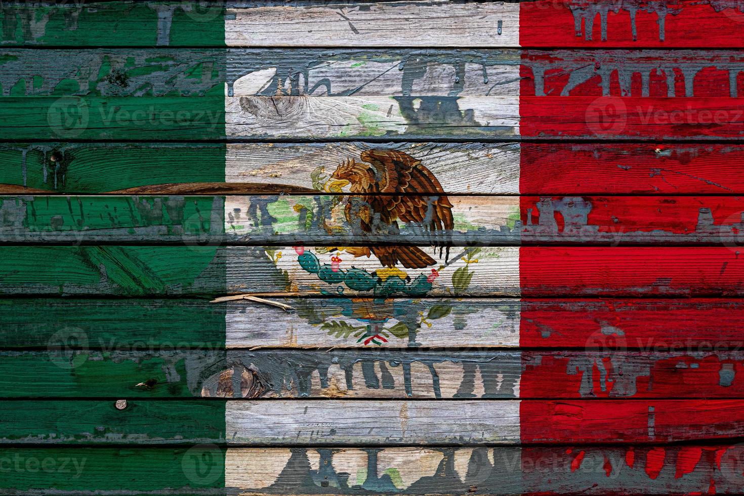 The national flag of Mexico  is painted on uneven boards. Country symbol. photo