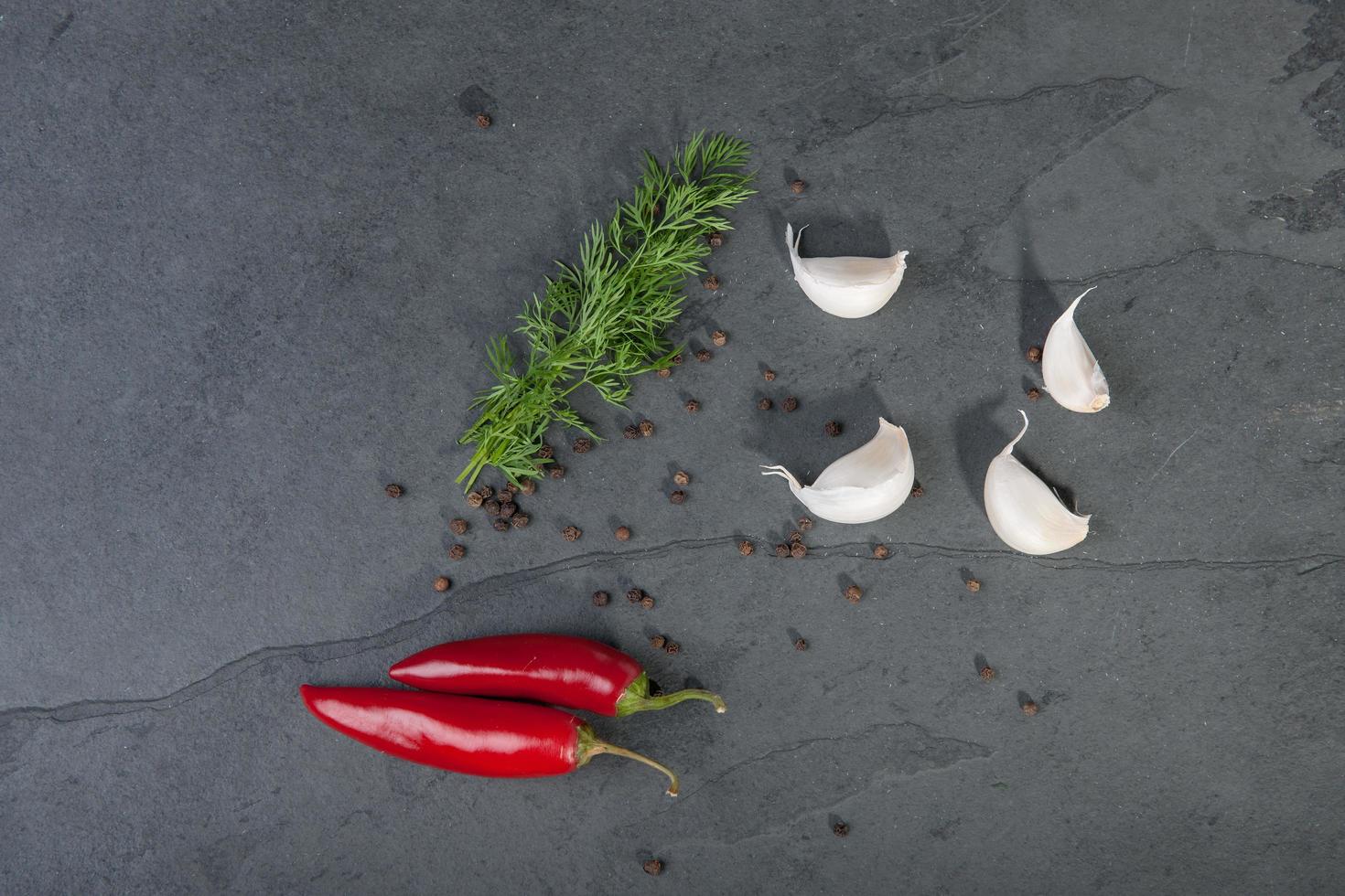 Dill, garlic, red peppers photo