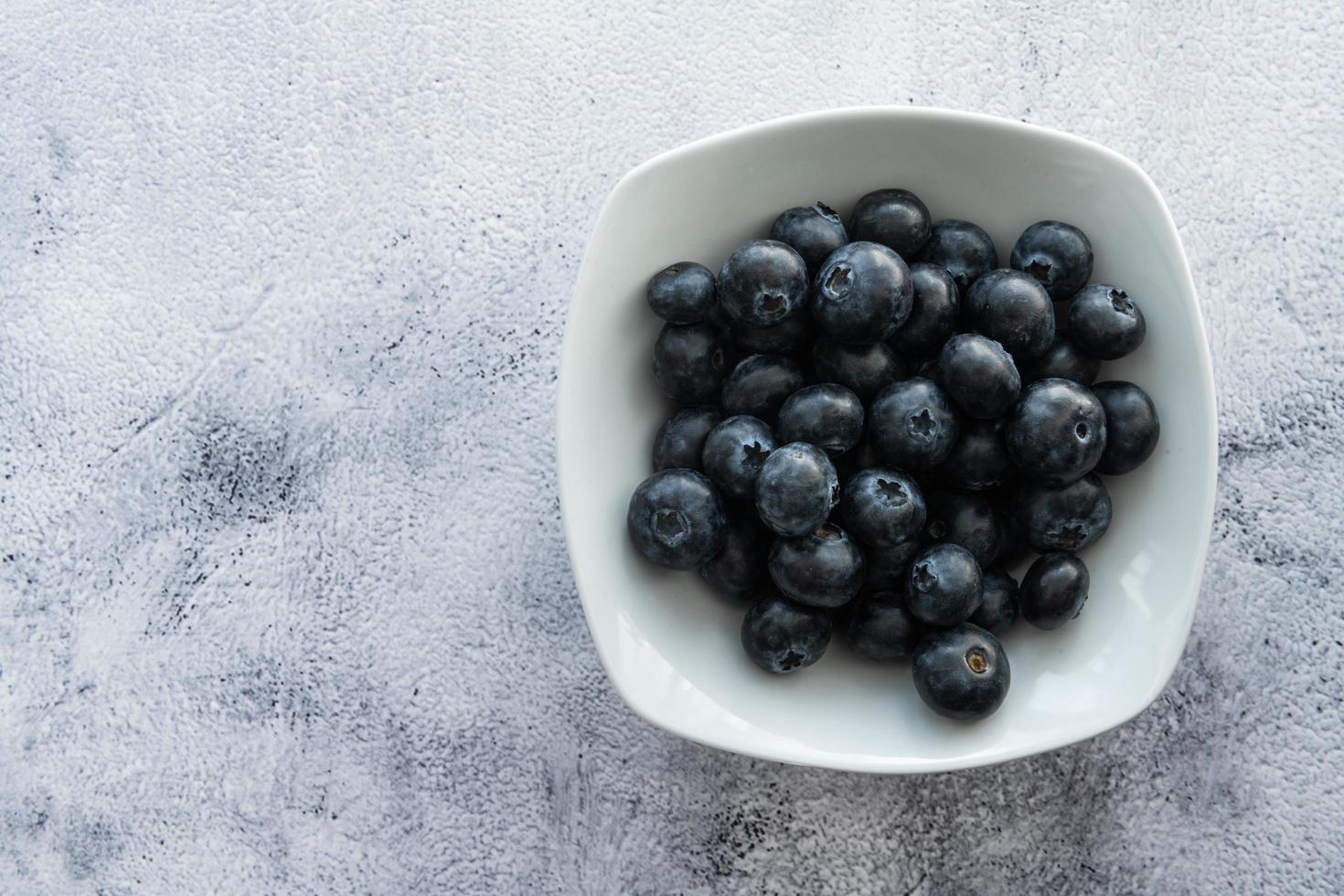 Delicious blueberries on a rustic background photo