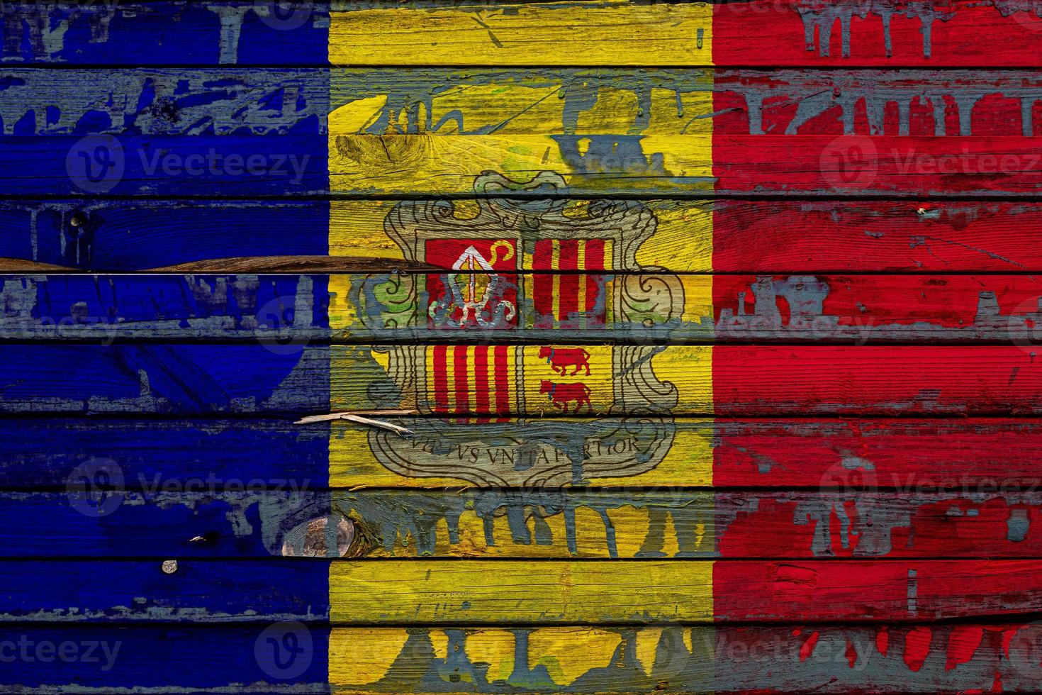 The national flag of Andorra is painted on uneven boards. Country symbol. photo