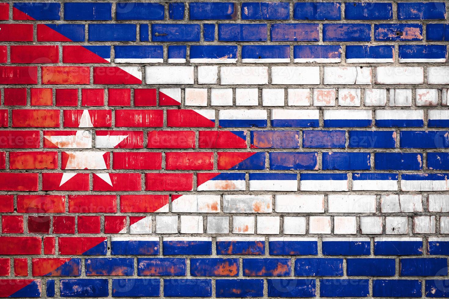 Cuban flag  on a grunge brick background. photo
