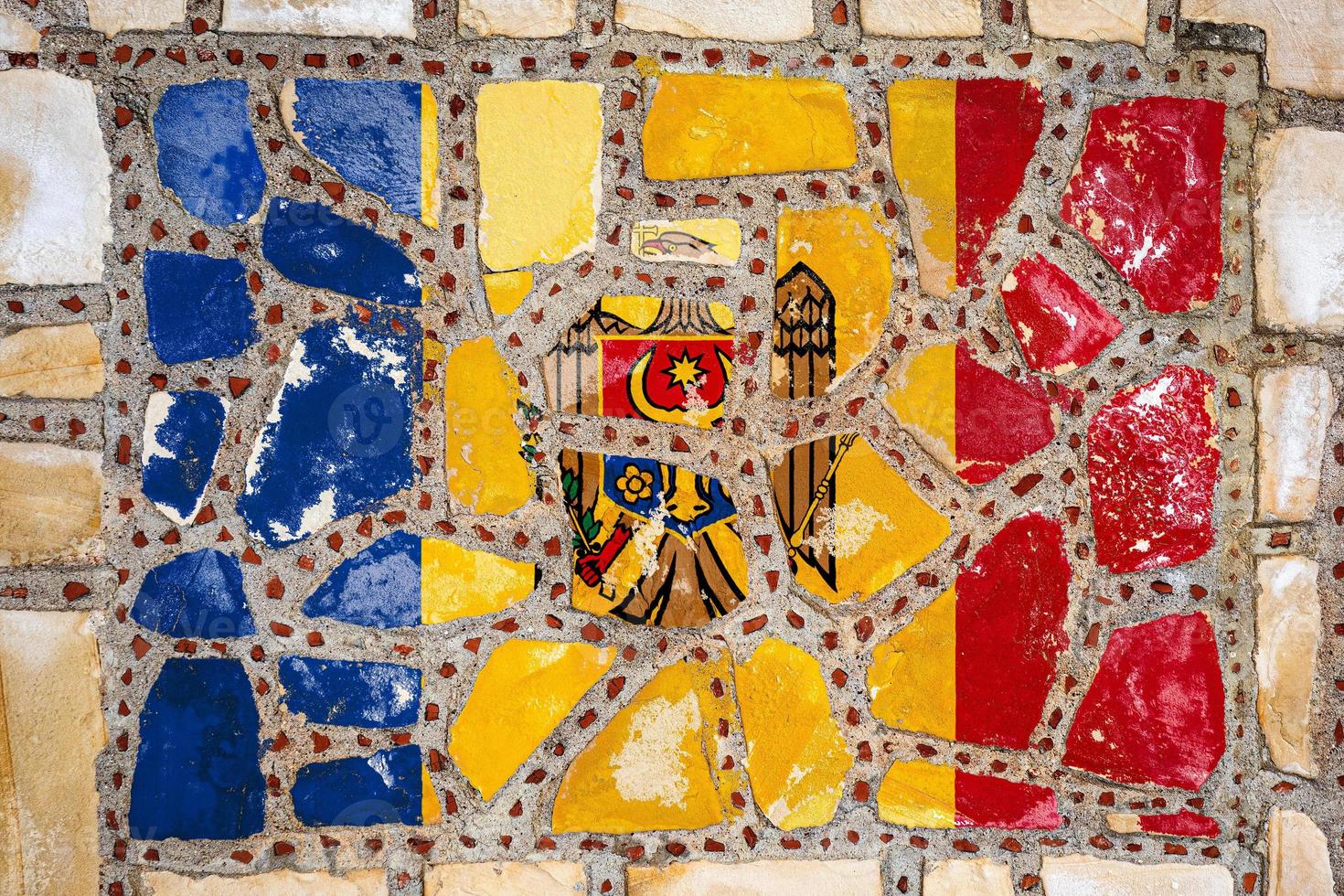 National flag of Moldova on stone  wall background. Flag  banner on  stone texture background. photo