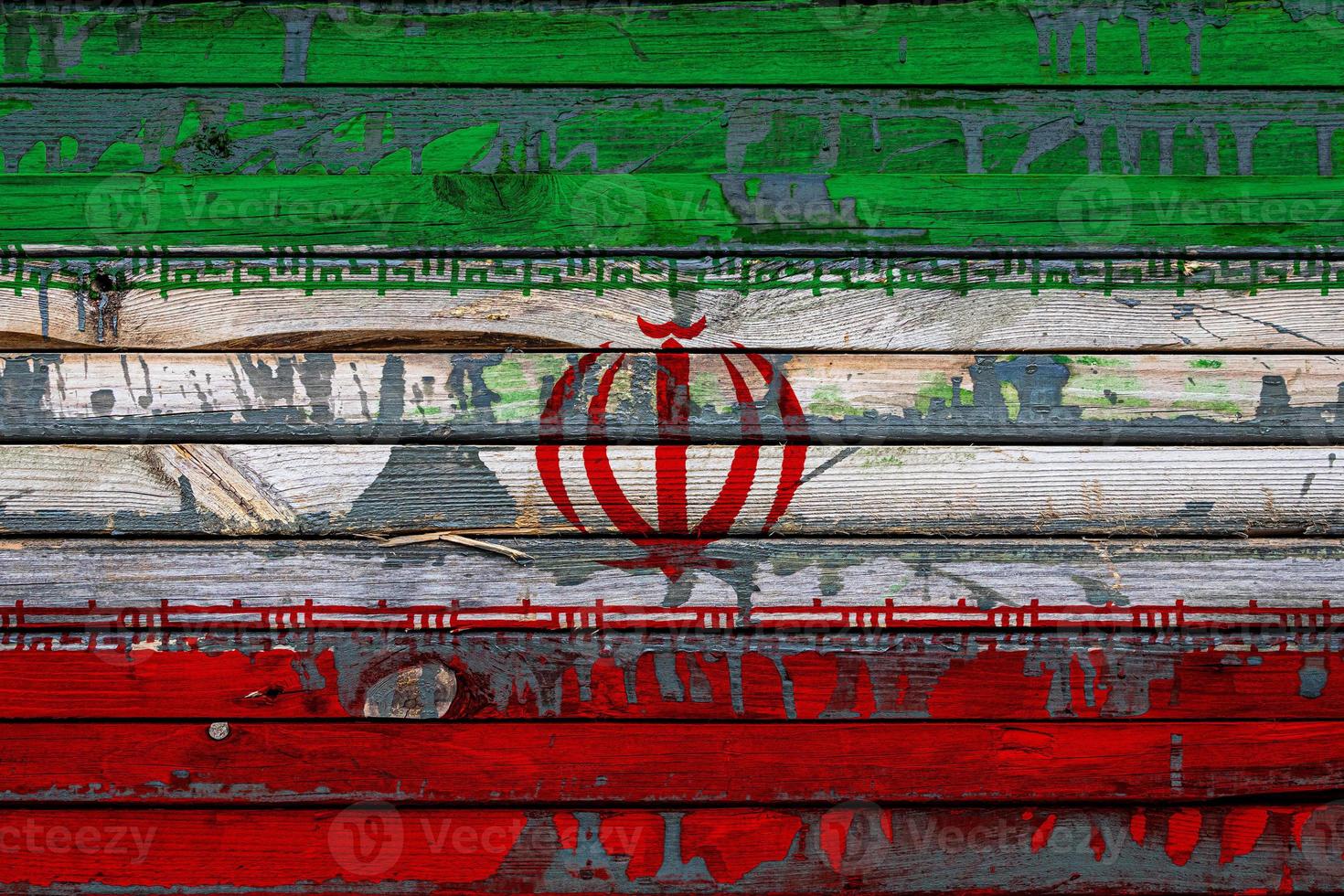 The national flag of Iran is painted on uneven boards. Country symbol. photo