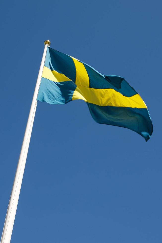 Swedish flag blowing in the wind photo