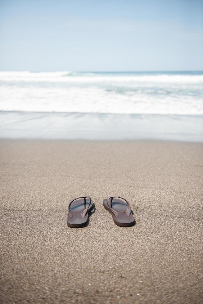 Flip flops on beach photo