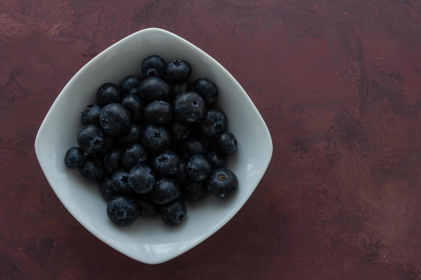 Delicious blueberries on a rustic background photo