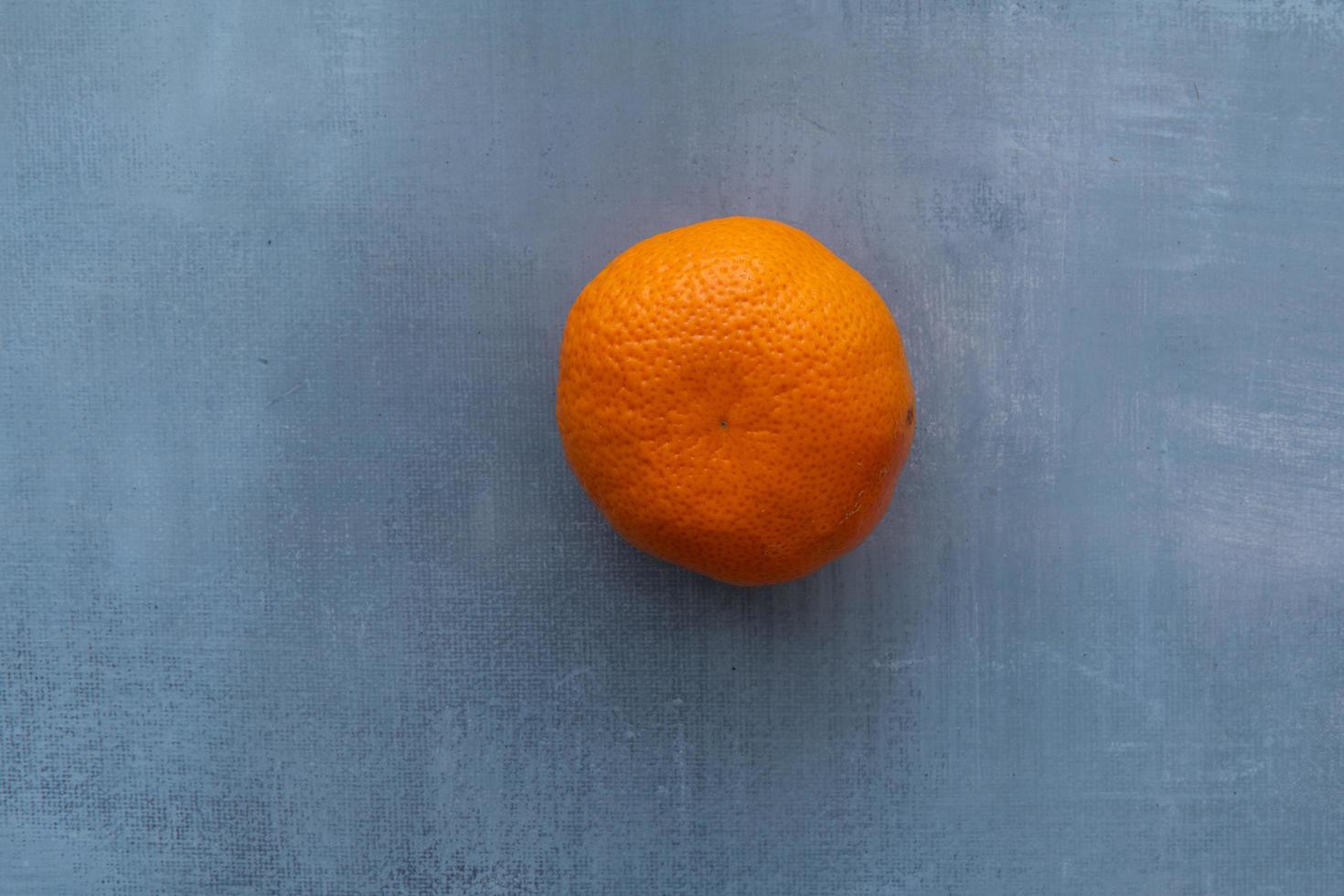 Delicious clementines on rustic background photo