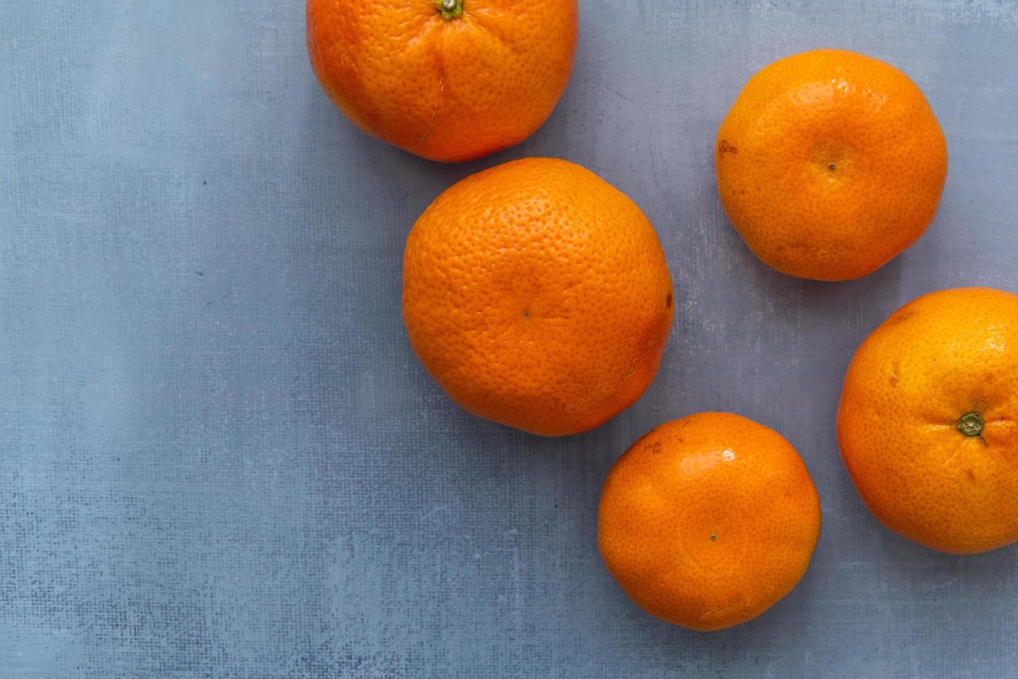 Delicious clementines on rustic background photo