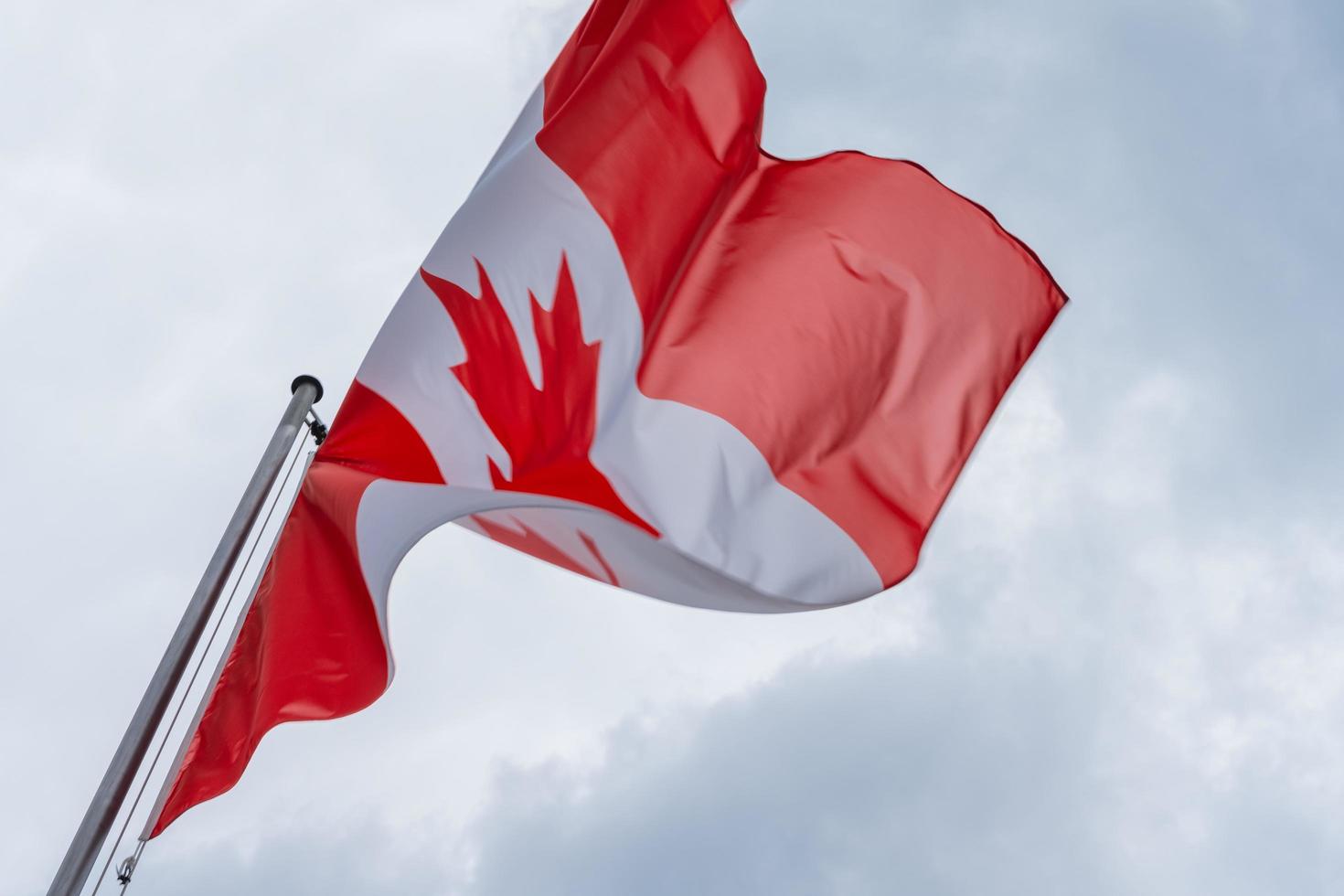 Canadian flag waving in the wind photo