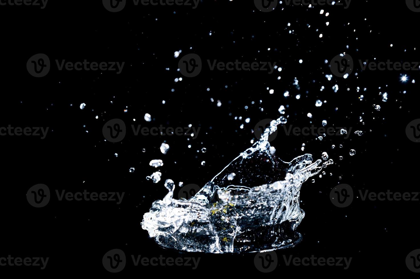 Abstract background of Water splashing on a black background. idea for freshness photo