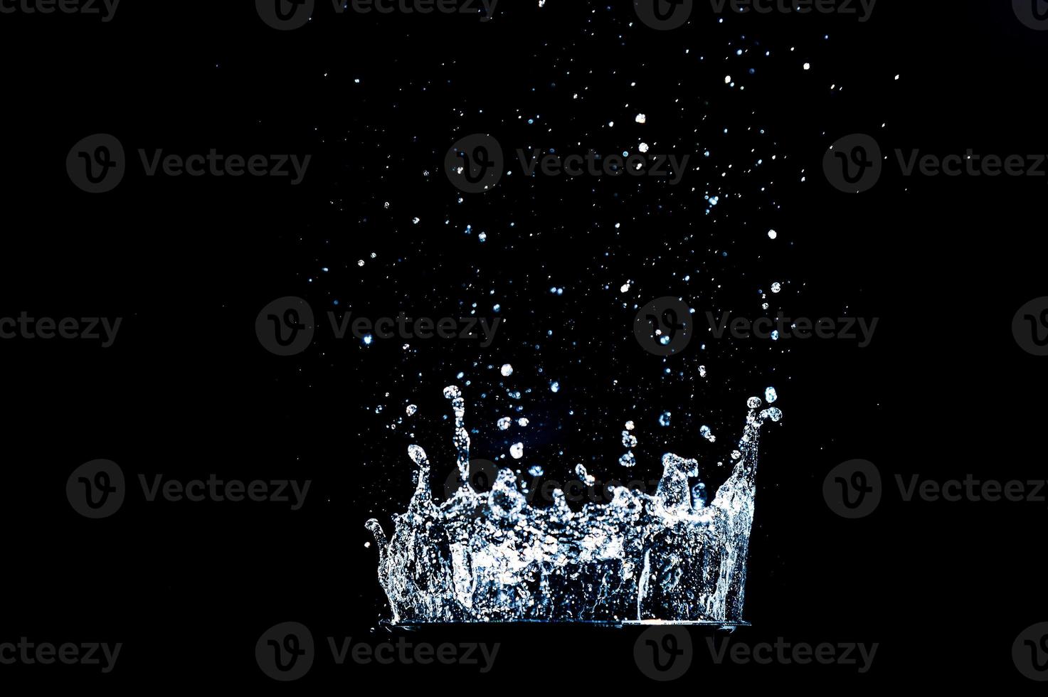 Abstract background of Water splashing on a black background. idea for freshness photo