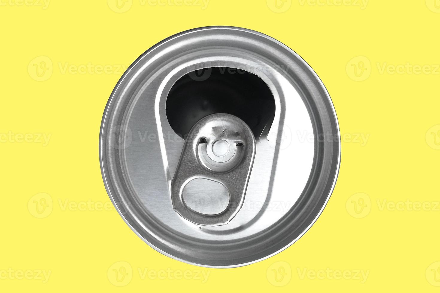 Top view of a opened soft drink can,The opened cans of soft drinks are made of aluminum and have light on the shiny surface on isolate. photo