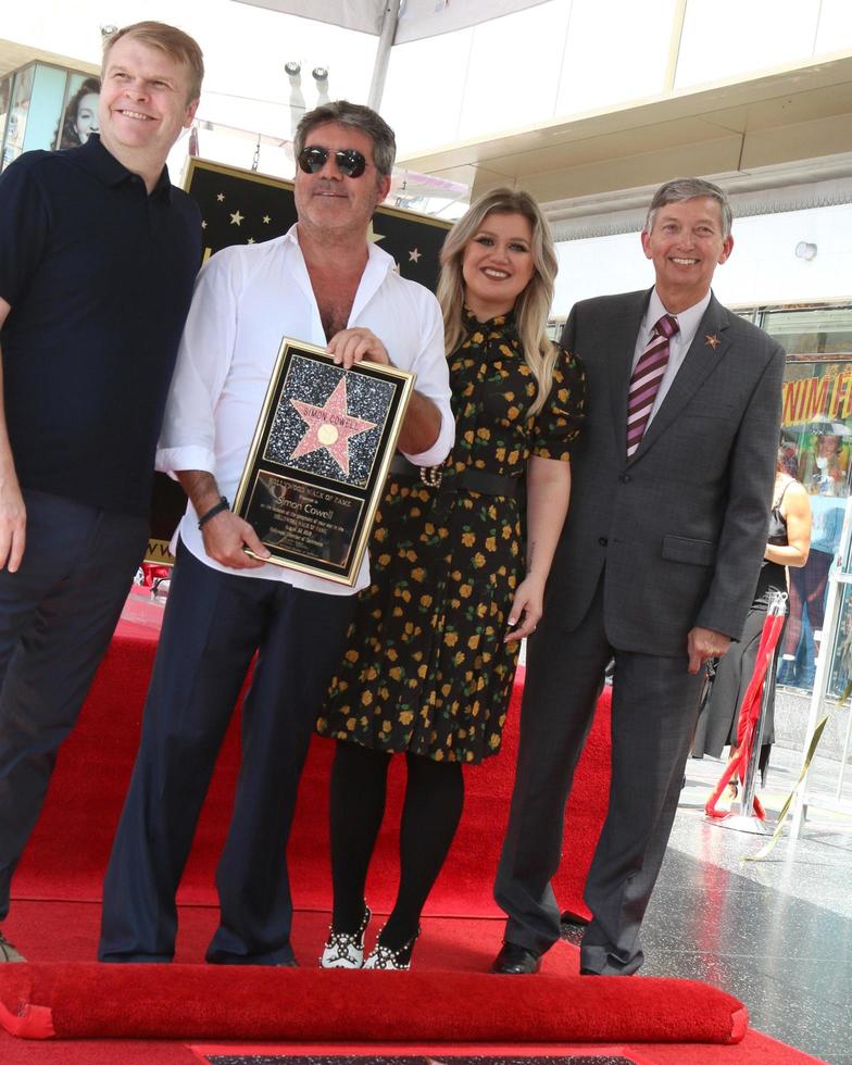 LOS ANGELES   AUG 22 - Rob Stringer, Simon Cowell, Kelly Carkson, Leron Gubler at the Simon Cowell Star Ceremony on the Hollywood Walk of Fame on August 22, 2018 in Los Angeles, CA photo