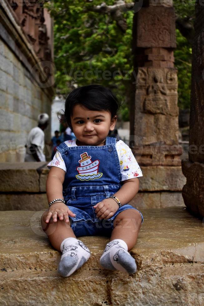 A cute little baby girl in joy mood photo
