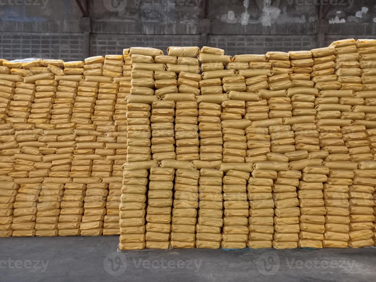 Chemical fertilizer The product stock is packed in sacks yellow , stacked in the warehouse, waiting for delivery. photo