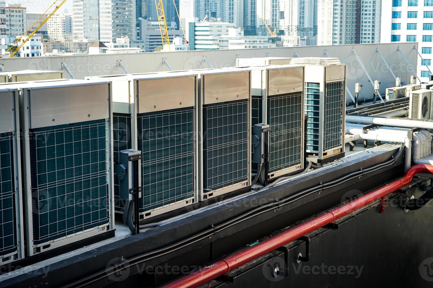 The industrial machine at the rooftop of the huge building. photo
