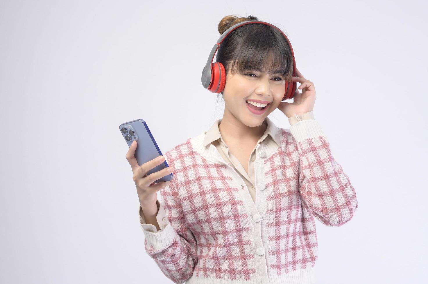 Young beautiful woman wearing headset on white background photo