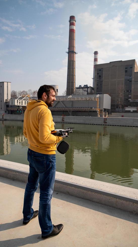 Videographer holding drone photo